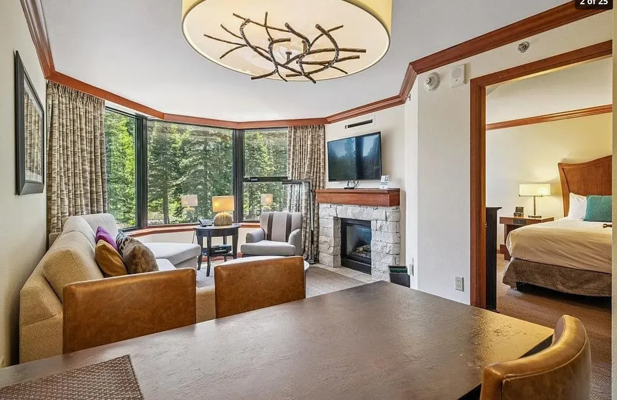 Two-bedroom corner suite — Dining & corner living; original listing photograph