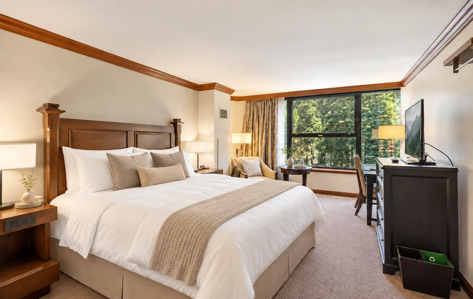 Private king room with a king bed and forest-facing window; digitally styled linens and accessories