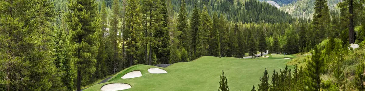 Fairways and bunkers at The Links at Everline, surrounded by pine forest and the Sierra mountains